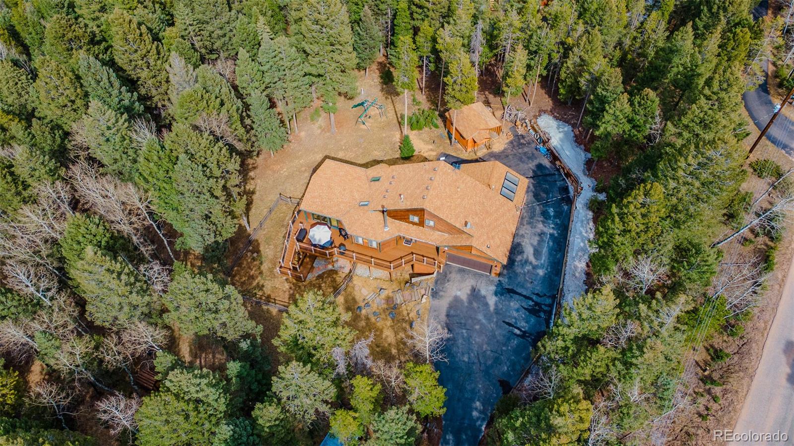 9590 South Warhawk Road Conifer, CO 80433 - Photo 39 of 43 an aerial view of residential house with outdoor space and trees all around