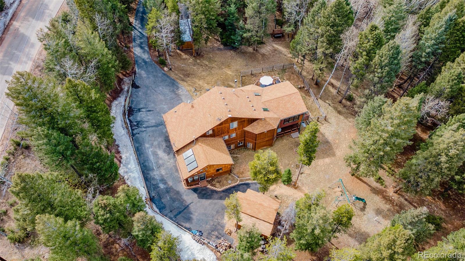 9590 South Warhawk Road Conifer, CO 80433 - Photo 40 of 43 an aerial view of a house with outdoor space