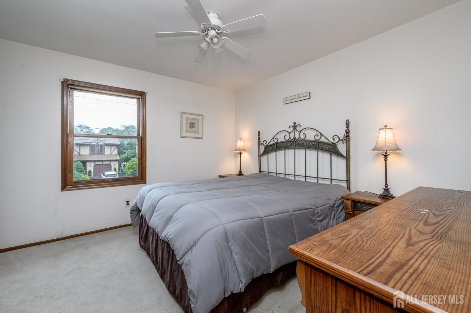 98 South Cliff Road Colonia, NJ 07067 - Photo 29 of 40 a bedroom with bed and window