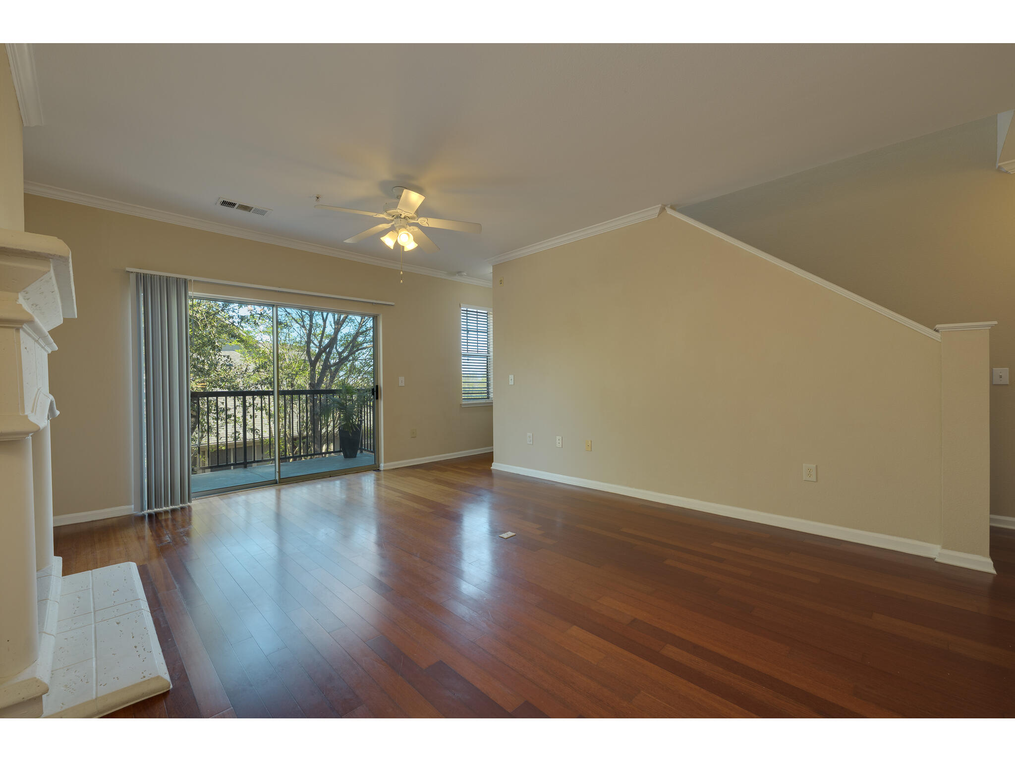 11203 Ranch Road 2222, Unit 106 Austin, TX 78732 - Photo 16 of 40 Another angle of the living room, towards the balcony