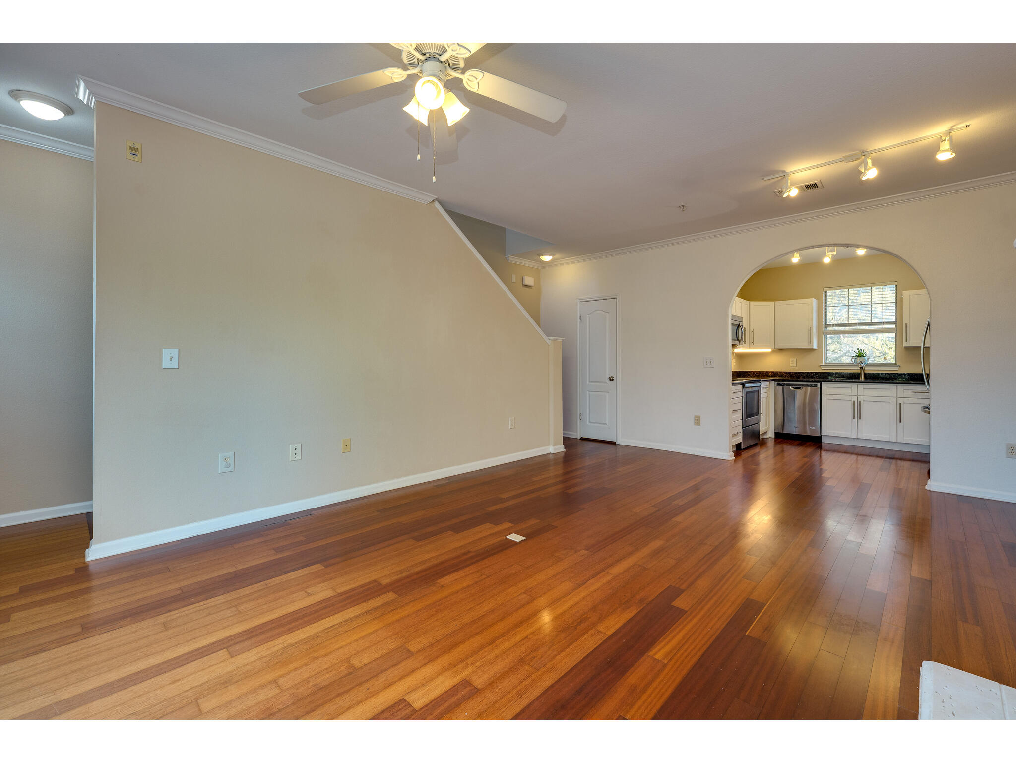 11203 Ranch Road 2222, Unit 106 Austin, TX 78732 - Photo 17 of 40 Behind the wall there are stairs going up to primary bedroom