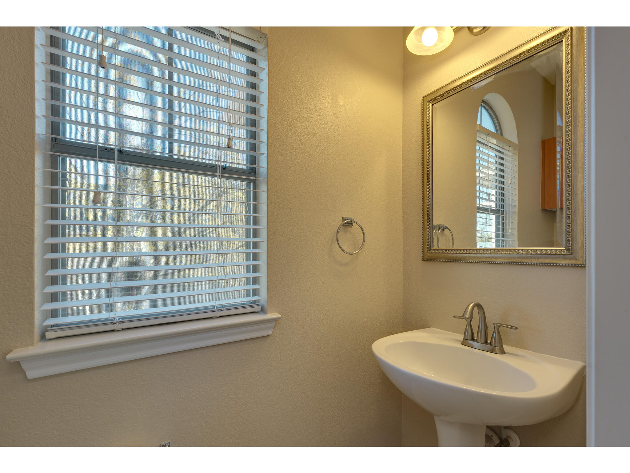 11203 Ranch Road 2222, Unit 106 Austin, TX 78732 - Photo 26 of 40 Half bath room is hiding by the stairs on the second floor.