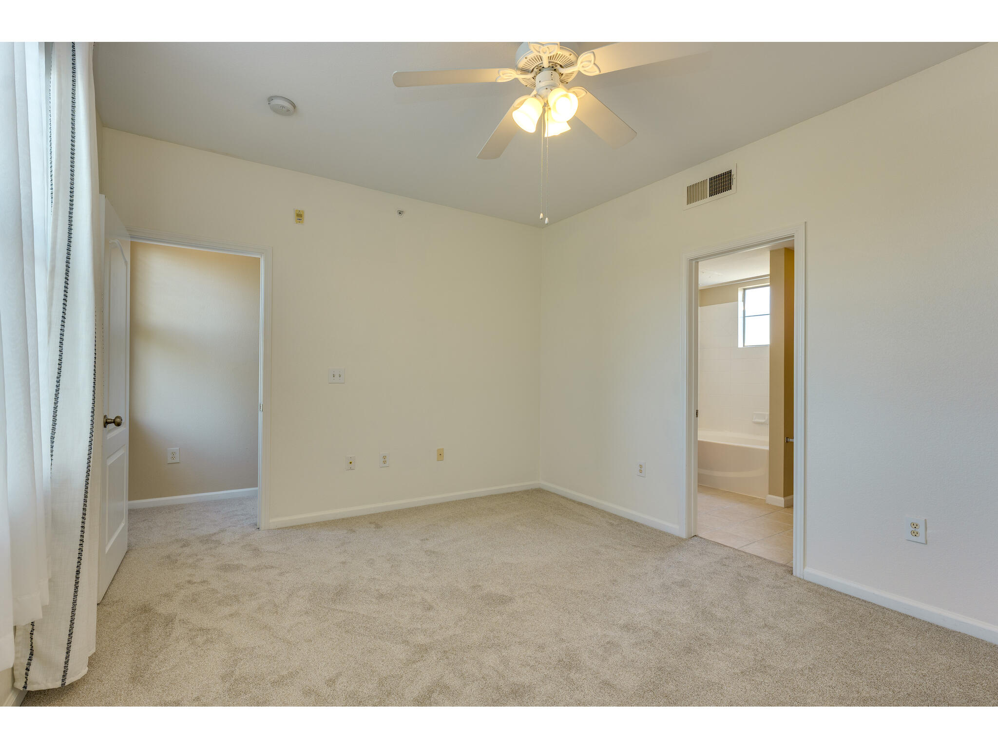 11203 Ranch Road 2222, Unit 106 Austin, TX 78732 - Photo 32 of 40 View from the back wall of the room towards the entrance and stairs