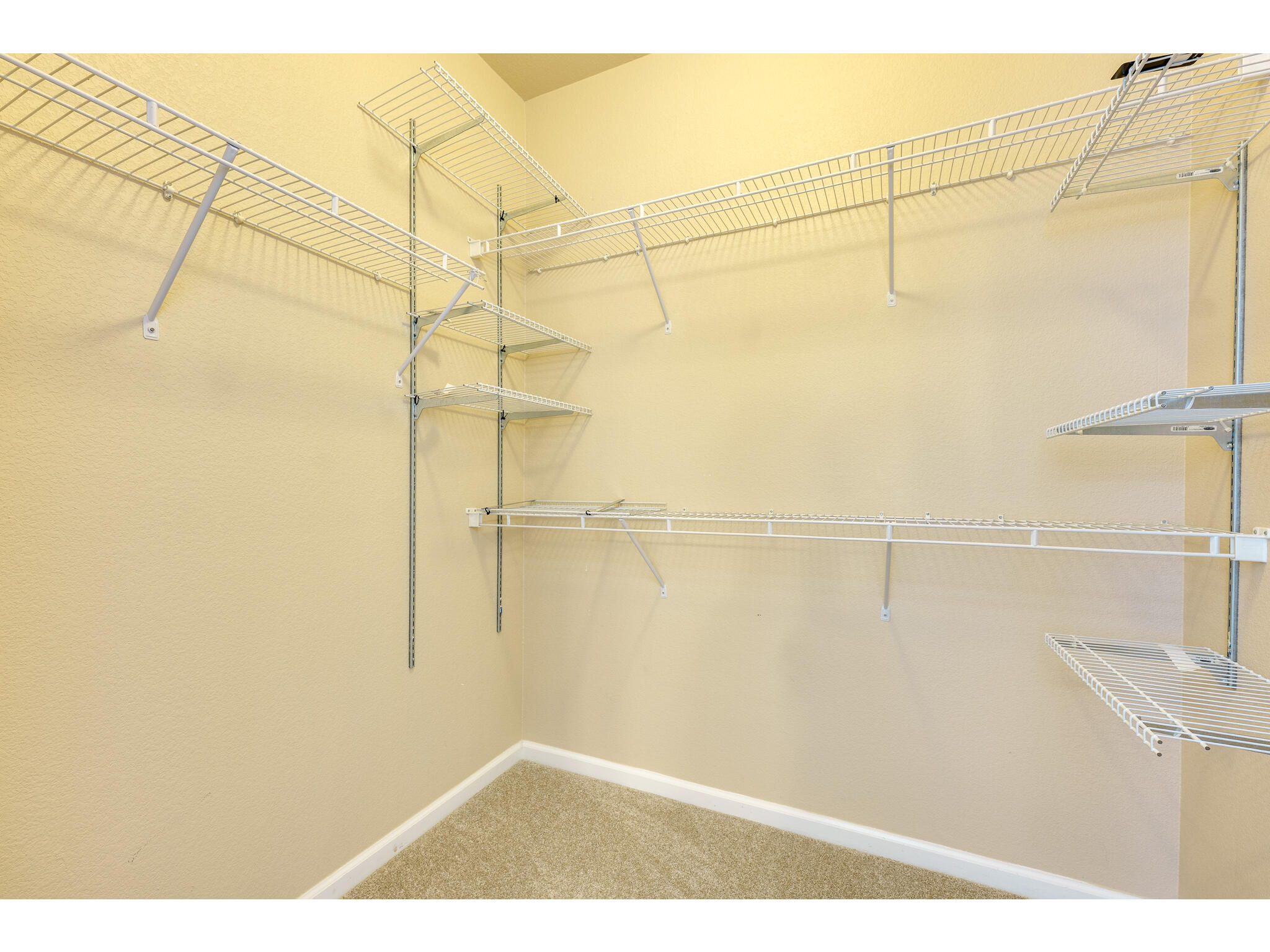 11203 Ranch Road 2222, Unit 106 Austin, TX 78732 - Photo 35 of 40 The walk-in closet in the primary bedroom offers ample storage space!