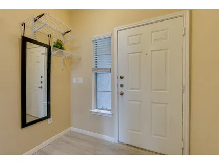 a view of a bathroom with a shower and a door
