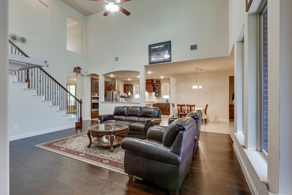 336 Red Hill Road Sunnyvale, TX 75182 - Photo 8 of 36 a living room with furniture a rug and a chandelier