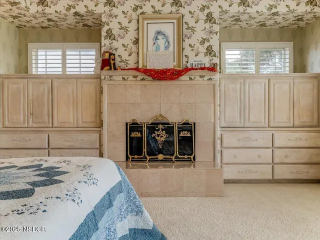 swimming pool view with a bed and a window