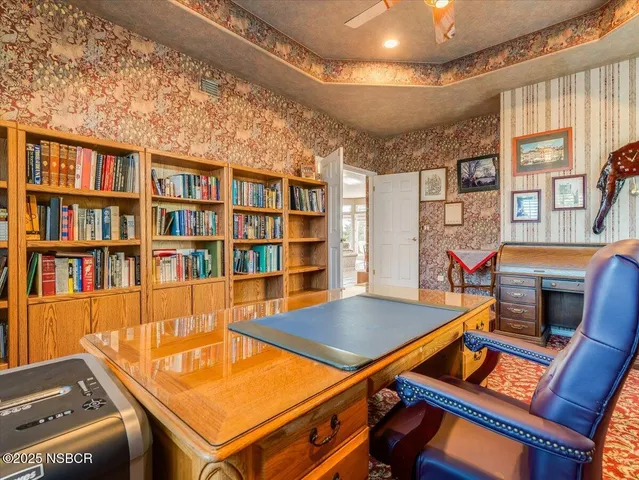 a room with furniture and a book shelf