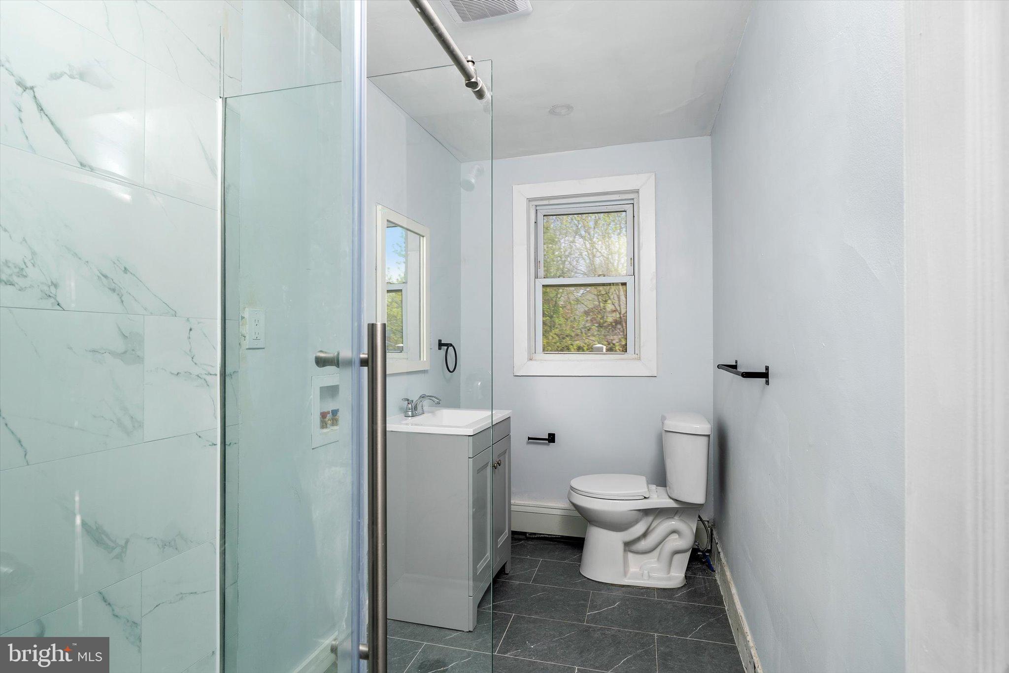 10 Lytle Street, Unit 3 Princeton, NJ 08542 - Photo 12 of 17 a bathroom with a toilet sink and a shower