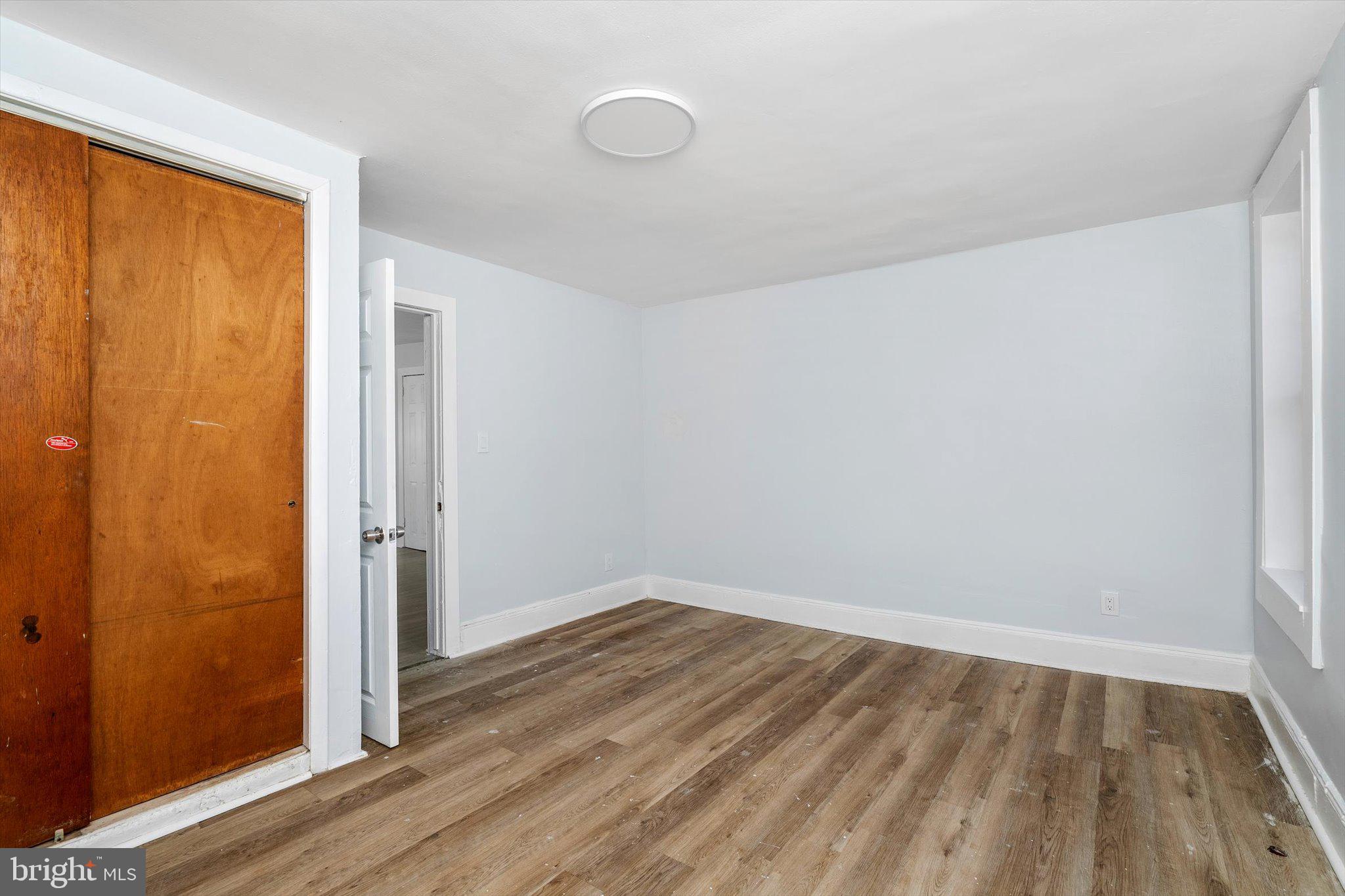 10 Lytle Street, Unit 3 Princeton, NJ 08542 - Photo 14 of 17 an empty room with wooden floor and windows