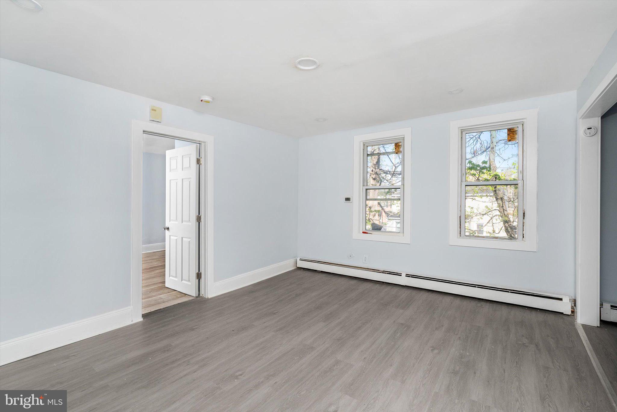 10 Lytle Street, Unit 3 Princeton, NJ 08542 - Photo 7 of 17 an empty room with wooden floor and windows