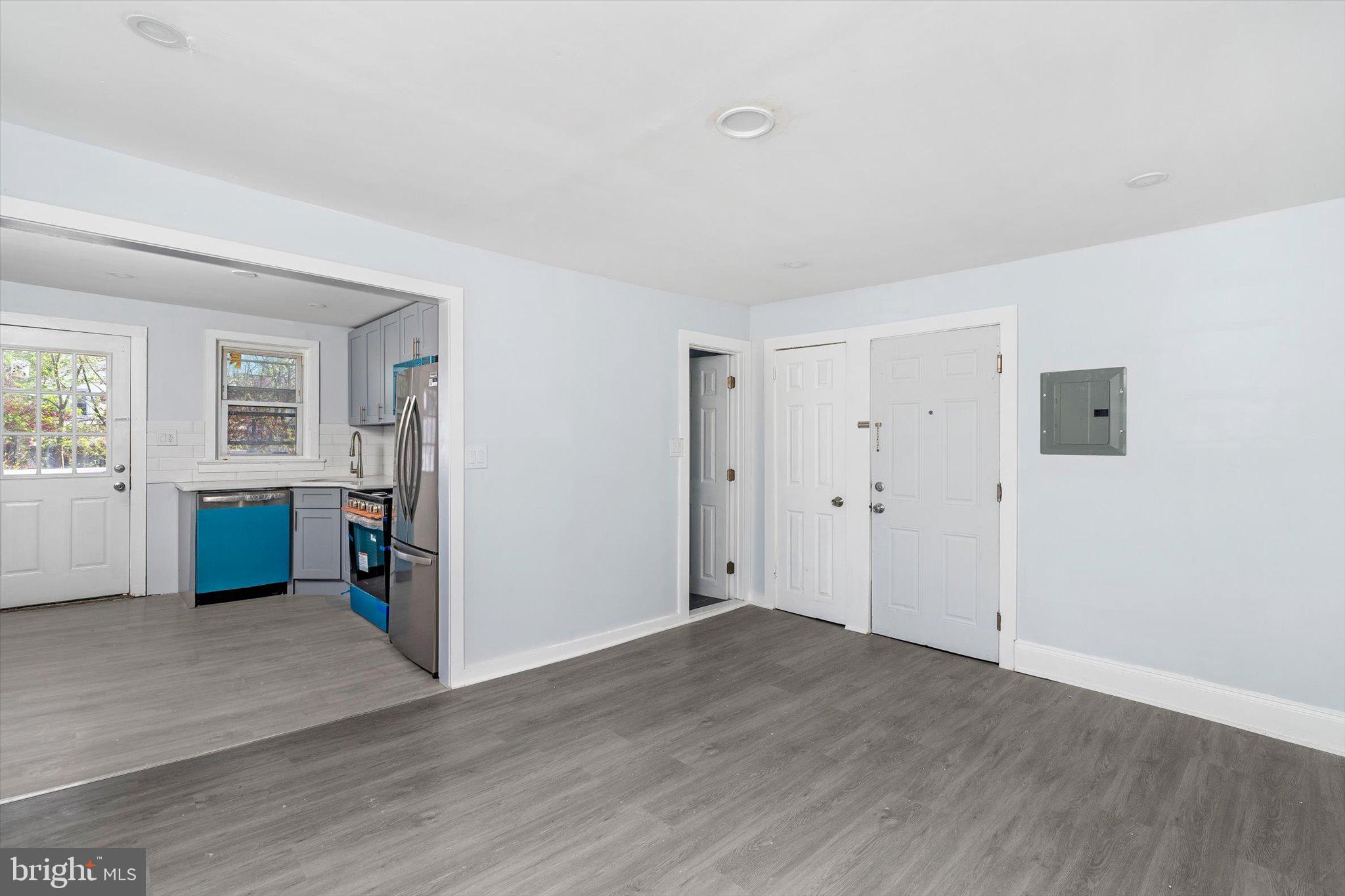 10 Lytle Street, Unit 3 Princeton, NJ 08542 - Photo 9 of 17 an empty room with wooden floor and windows