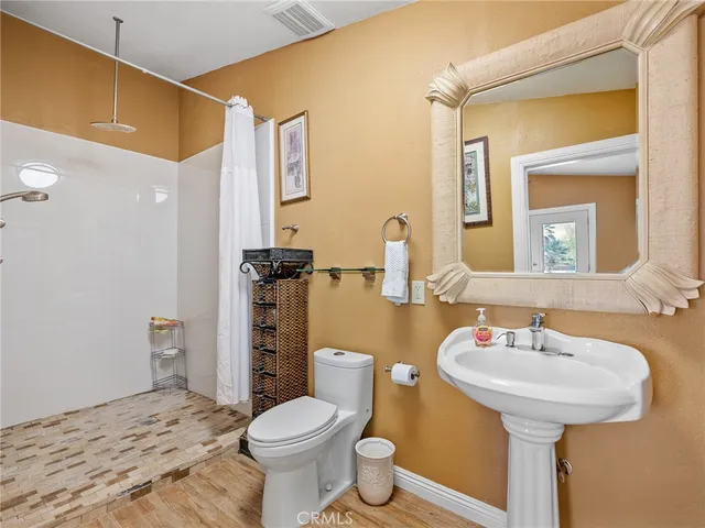 an entrance to house with yard and seating space