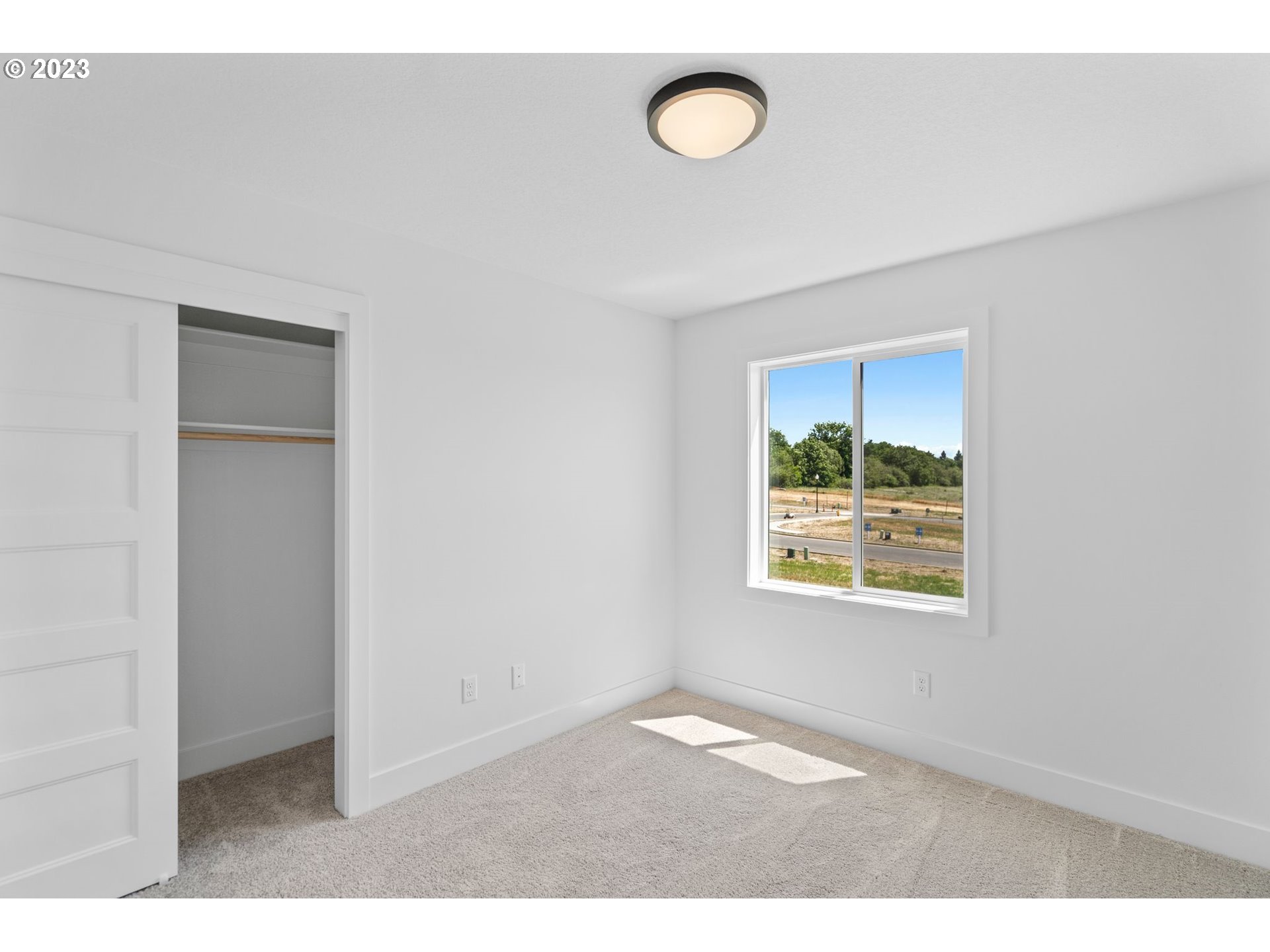 715 Northwest 175th Way Ridgefield, WA 98642 - Photo 15 of 26 a view of an empty room with a window