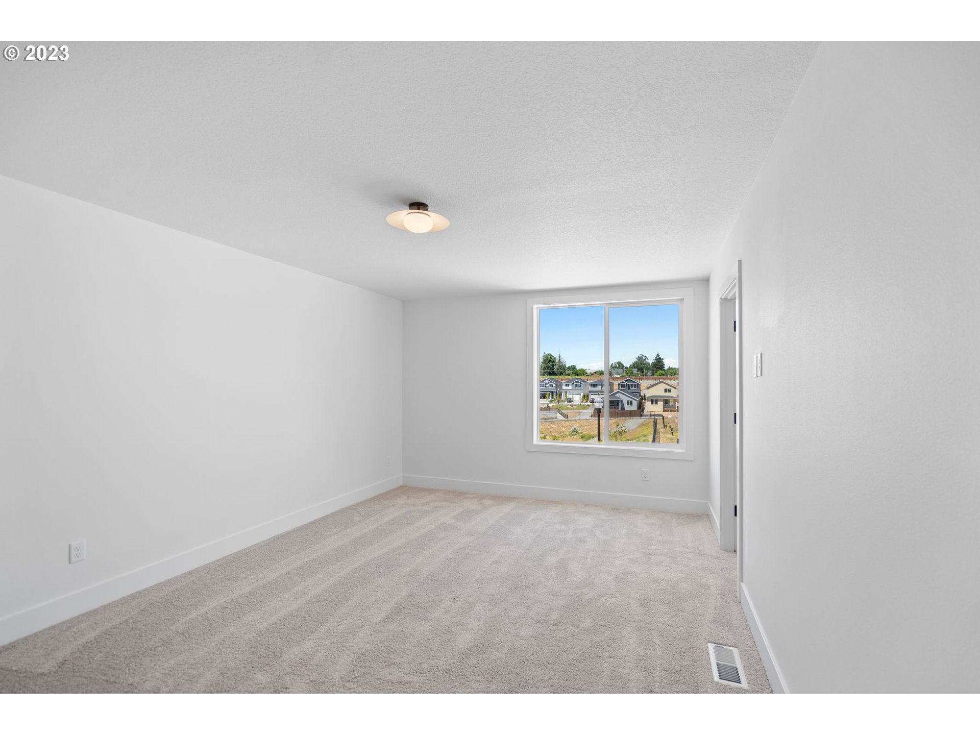 715 Northwest 175th Way Ridgefield, WA 98642 - Photo 20 of 26 a view of an empty room and window