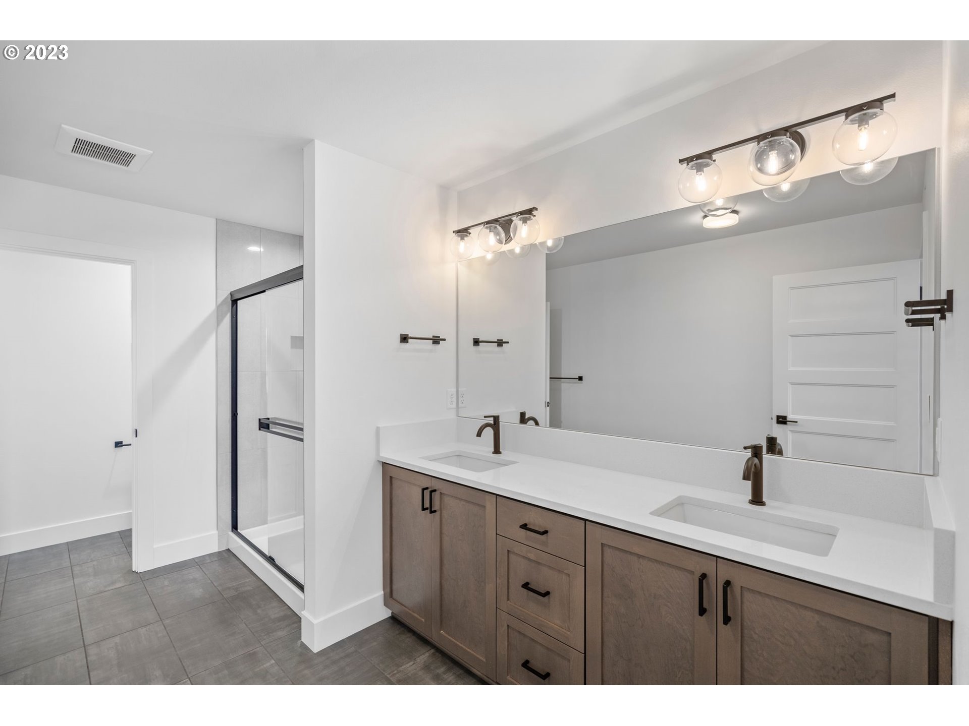 715 Northwest 175th Way Ridgefield, WA 98642 - Photo 23 of 26 a bathroom with a double vanity sink mirror and double