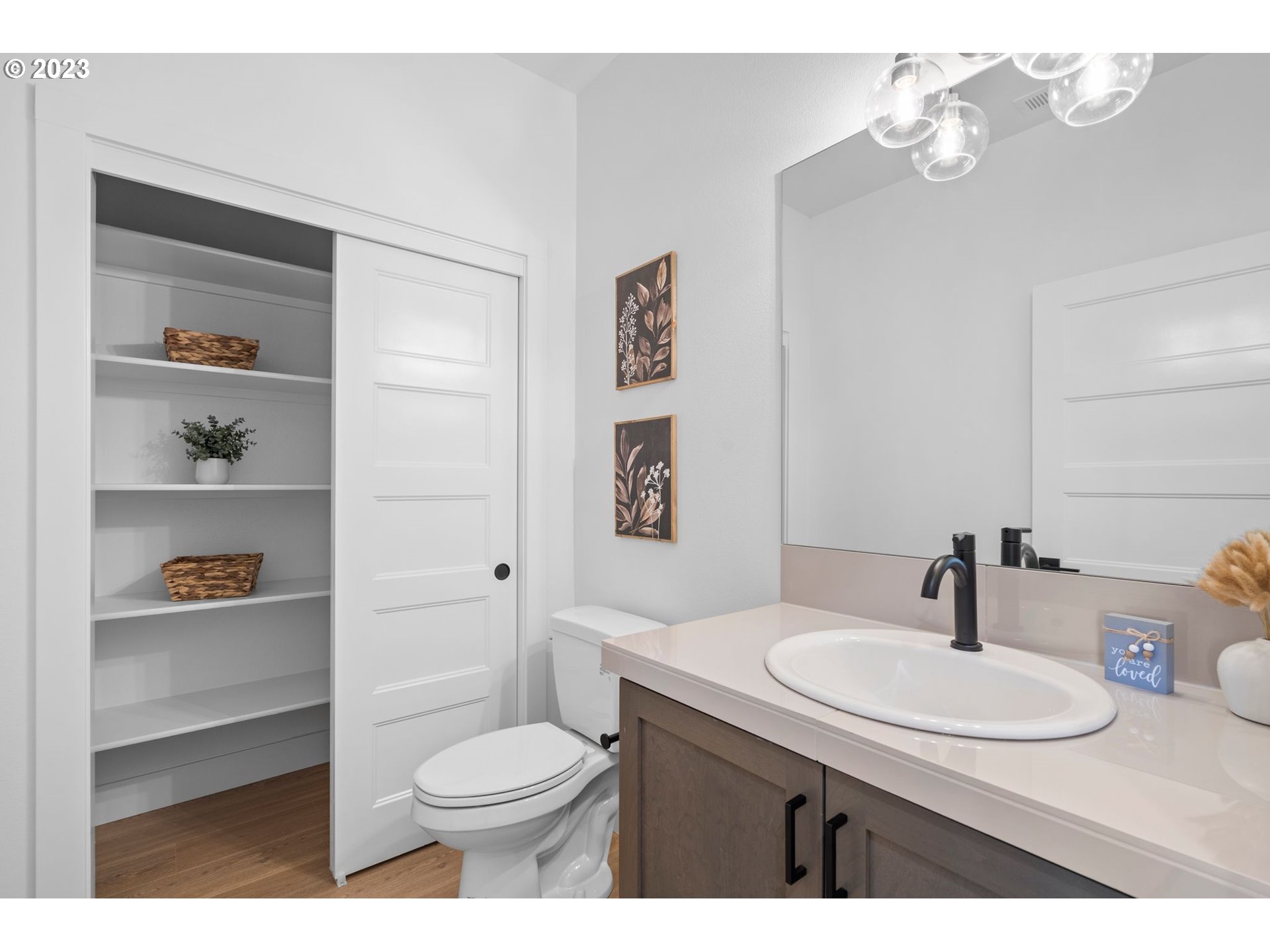 715 Northwest 175th Way Ridgefield, WA 98642 - Photo 10 of 26 a bathroom with a sink a toilet and a mirror