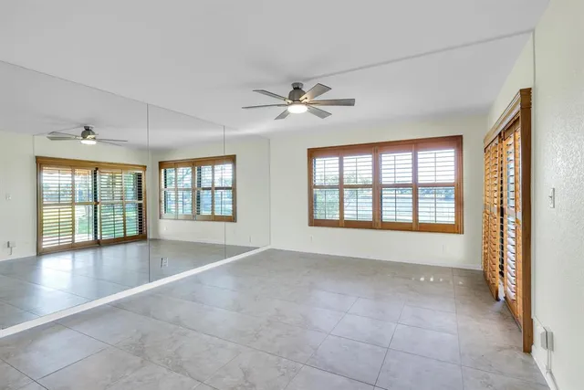 a bathroom with a double vanity sink mirror and shower