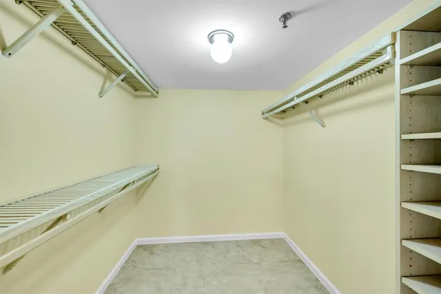 a view of a lake with houses in the back