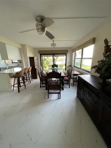 a view of a livingroom with furniture and a flat screen tv