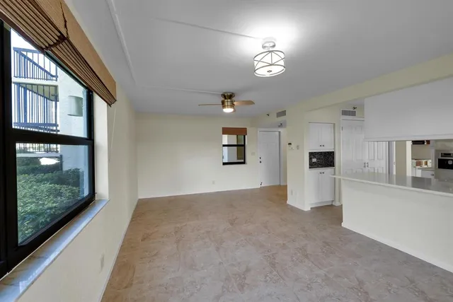 a kitchen with stainless steel appliances a refrigerator and a stove top oven
