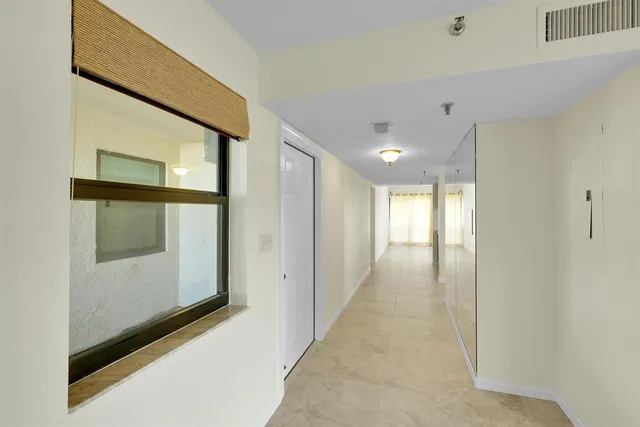 a kitchen with cabinets appliances and a counter space