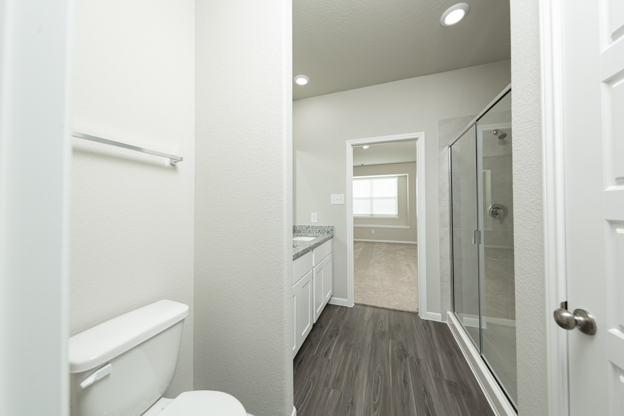 3878 Avalon Lane Conroe, TX 77301 - Photo 12 of 28 a bathroom with a toilet and a shower
