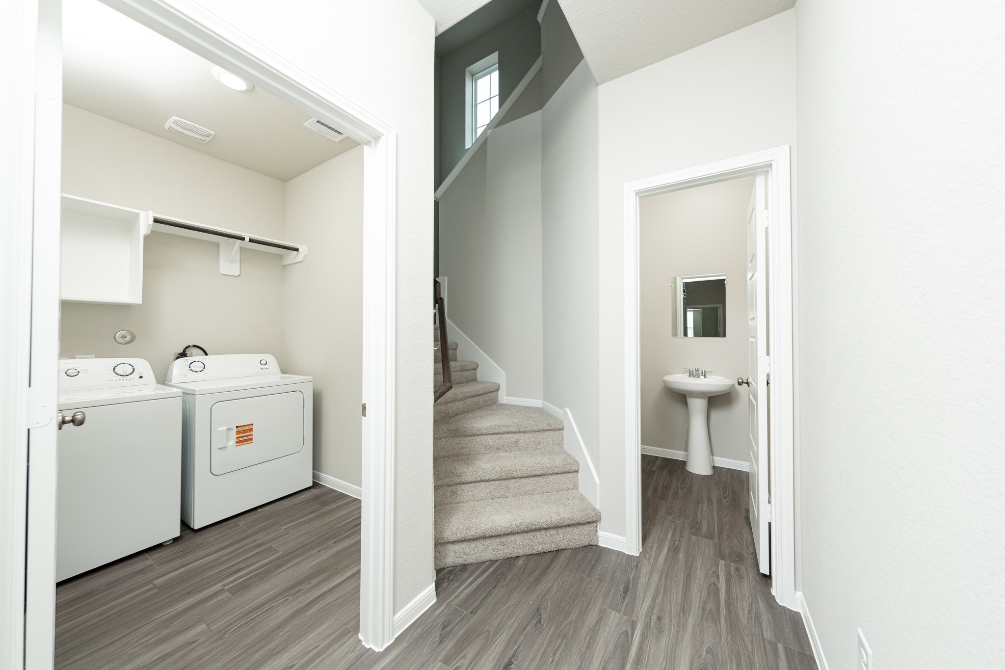 3878 Avalon Lane Conroe, TX 77301 - Photo 13 of 28 a view of entryway with wooden floor and staircase