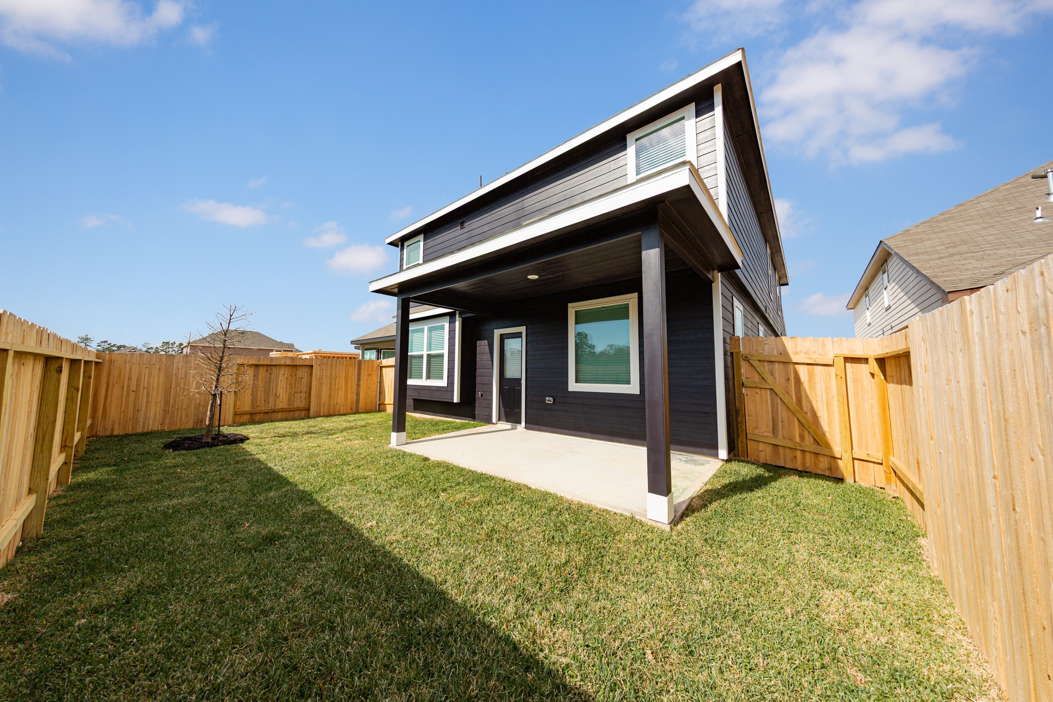 3878 Avalon Lane Conroe, TX 77301 - Photo 22 of 28 a view of house with backyard and tub