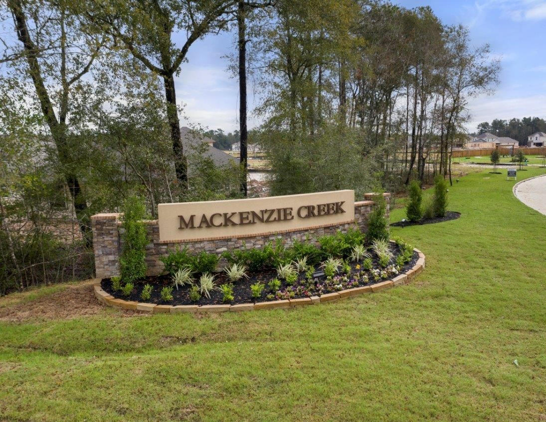 3878 Avalon Lane Conroe, TX 77301 - Photo 25 of 28 a sign on the side of the road
