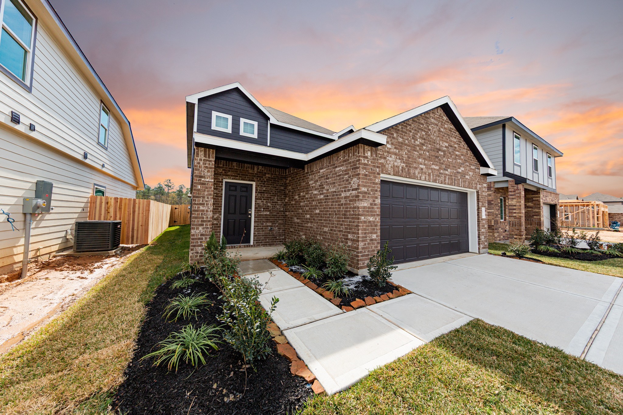 3878 Avalon Lane Conroe, TX 77301 - Photo 3 of 28 a front view of a house with a yard