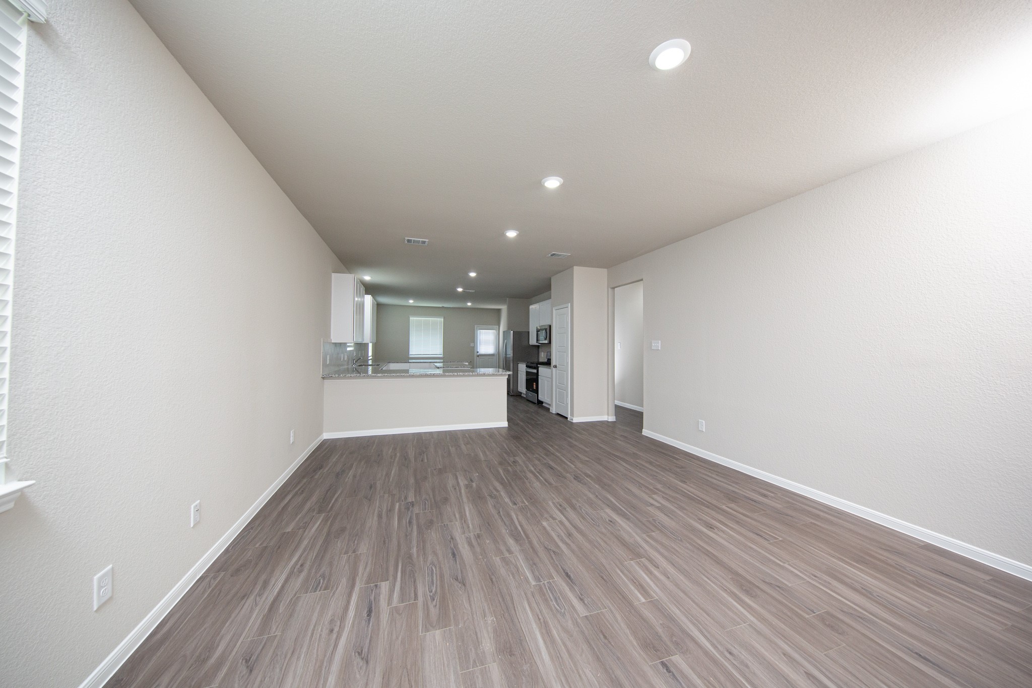 3878 Avalon Lane Conroe, TX 77301 - Photo 5 of 28 a view of empty room with wooden floor