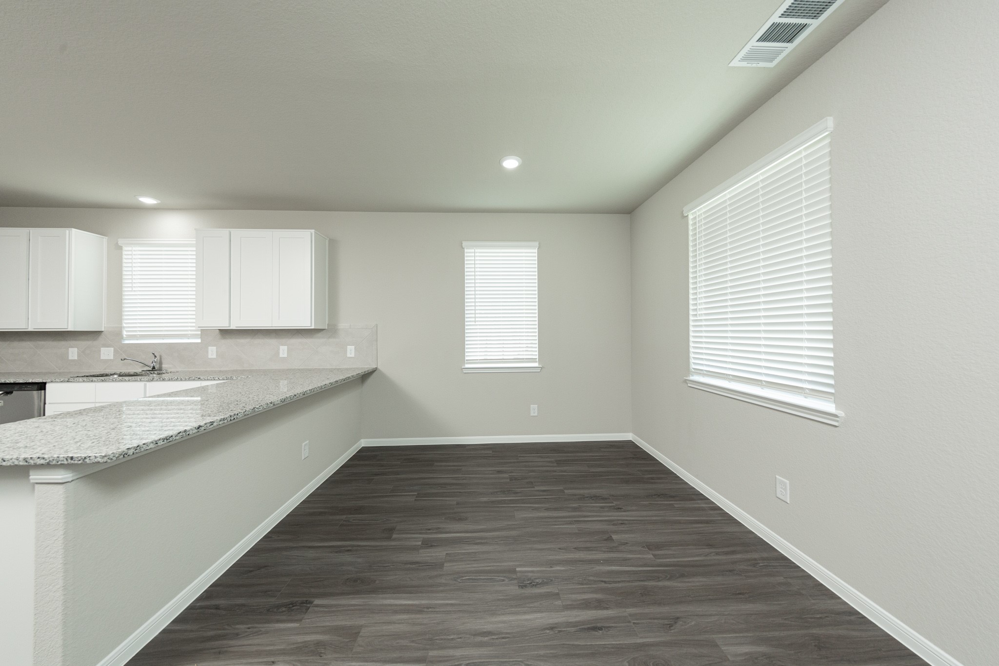 3878 Avalon Lane Conroe, TX 77301 - Photo 8 of 28 a view of a kitchen with wooden floor and a sink