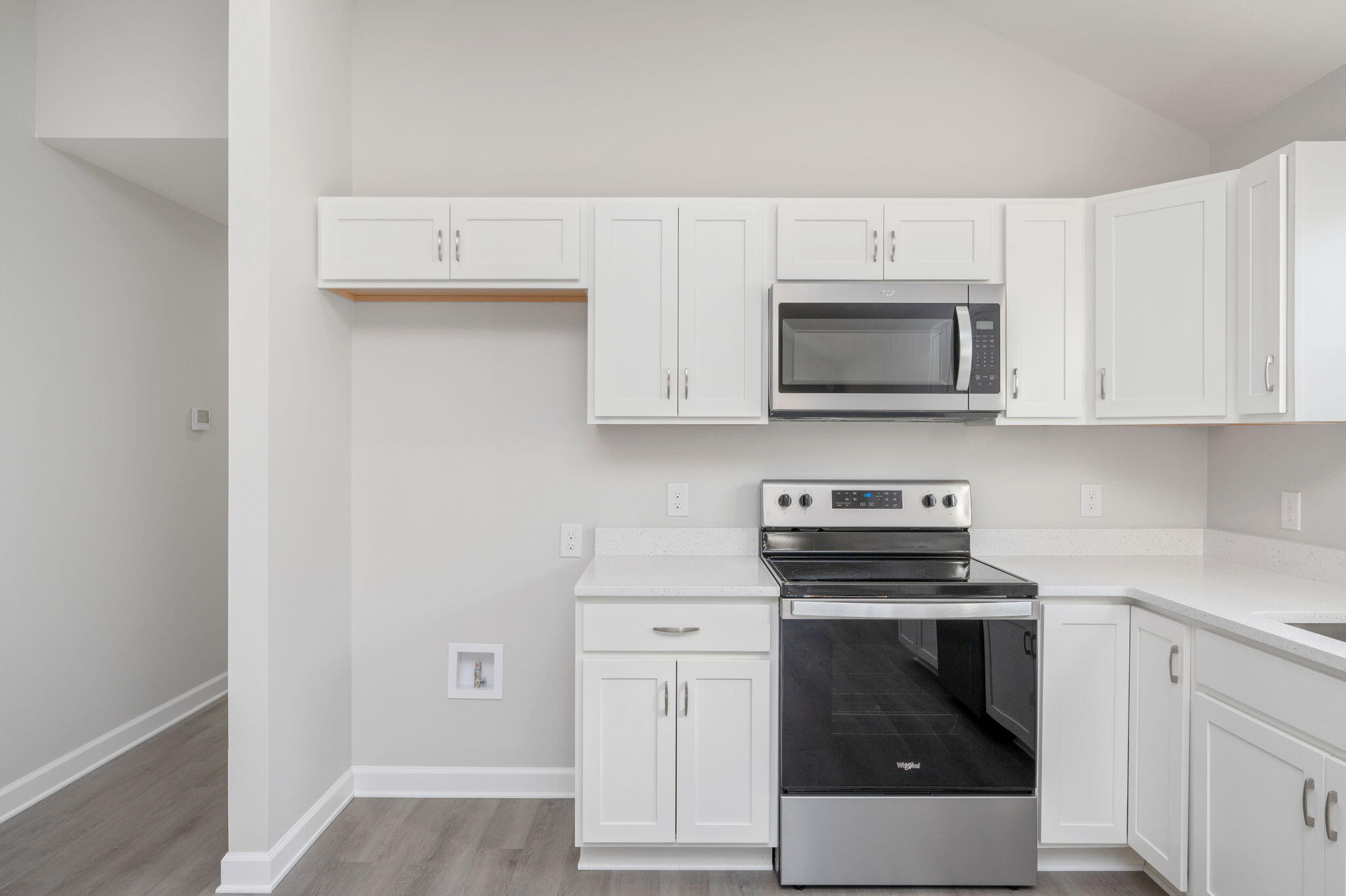 1002 Valley Road Crestview, FL 32539 - Photo 12 of 31 a kitchen with granite countertop white cabinets and stainless steel appliances