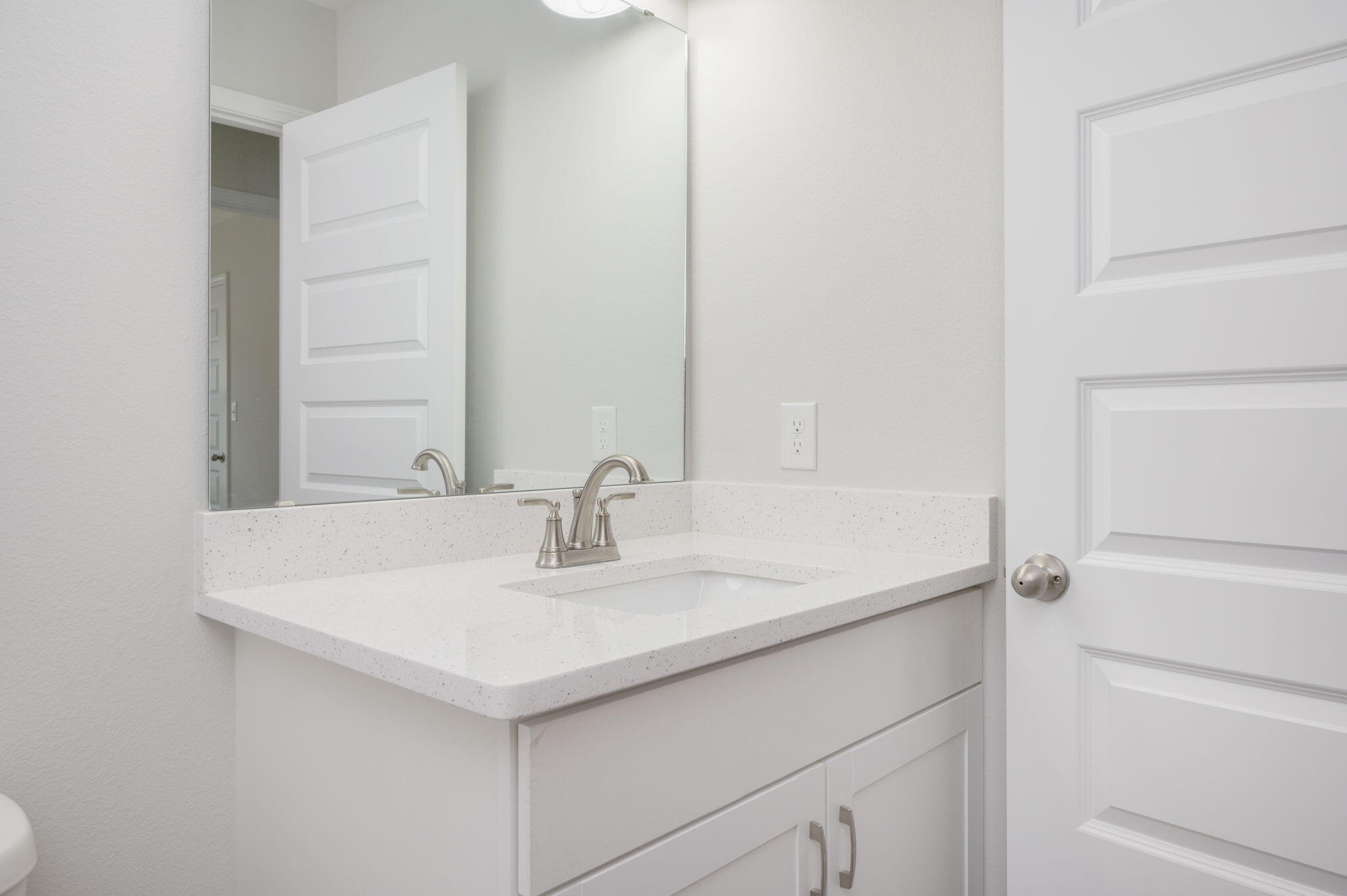 1002 Valley Road Crestview, FL 32539 - Photo 18 of 31 a bathroom with a sink and a mirror