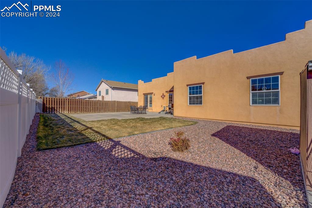 111 Rocchio Drive Florence, CO 81226 - Photo 11 of 50 a view of an house with backyard space and a tree