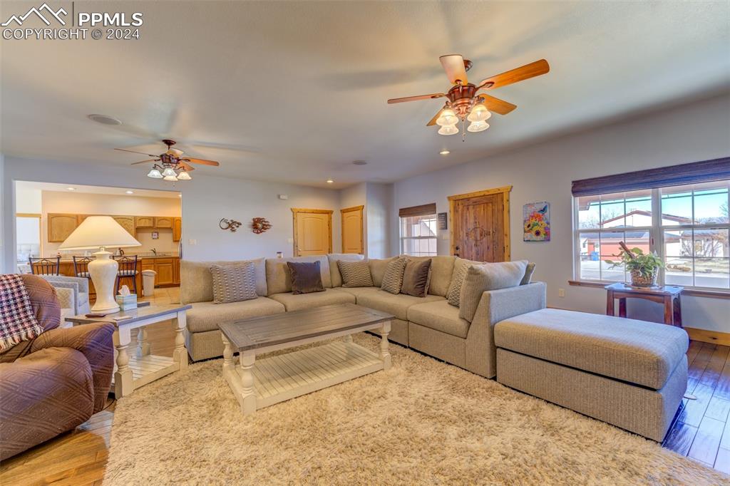 111 Rocchio Drive Florence, CO 81226 - Photo 17 of 50 a living room with furniture a chandelier and a window