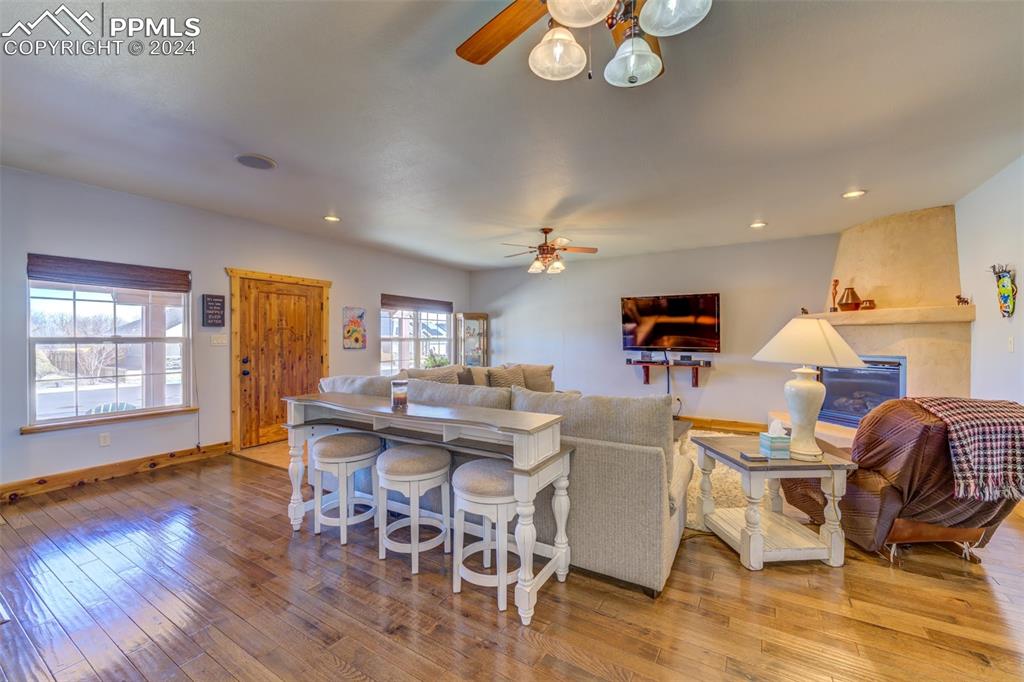 111 Rocchio Drive Florence, CO 81226 - Photo 20 of 50 a view of a dining room with furniture a chandelier and wooden floor