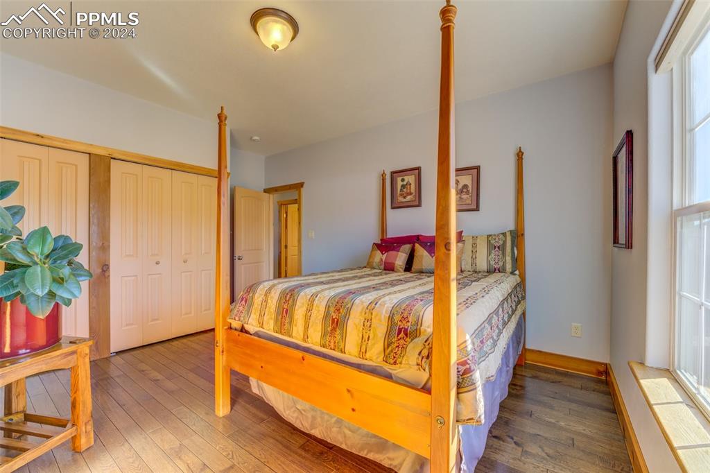 111 Rocchio Drive Florence, CO 81226 - Photo 27 of 50 a bed sitting in a bedroom next to a window