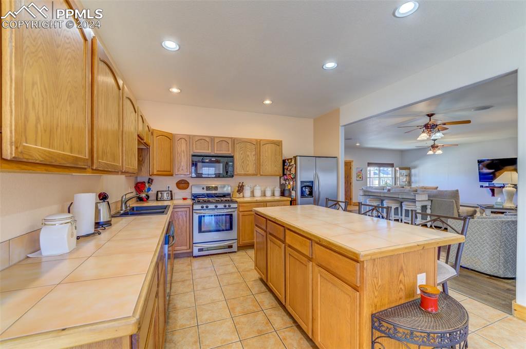111 Rocchio Drive Florence, CO 81226 - Photo 34 of 50 a large kitchen with sink a counter top space and appliances