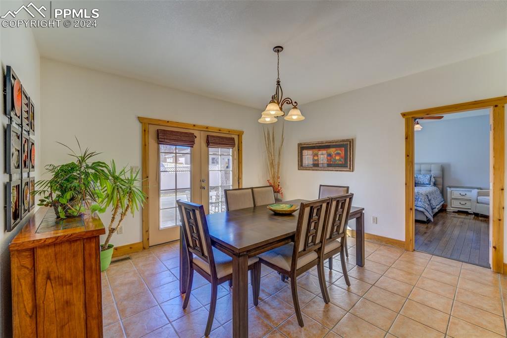 111 Rocchio Drive Florence, CO 81226 - Photo 36 of 50 a view of a dining room with furniture and a chandelier