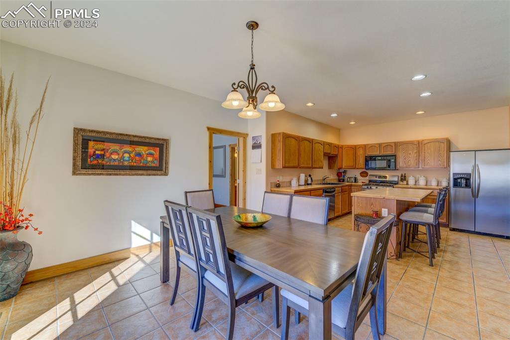 111 Rocchio Drive Florence, CO 81226 - Photo 40 of 50 a dining room filled chandelier and kitchen view