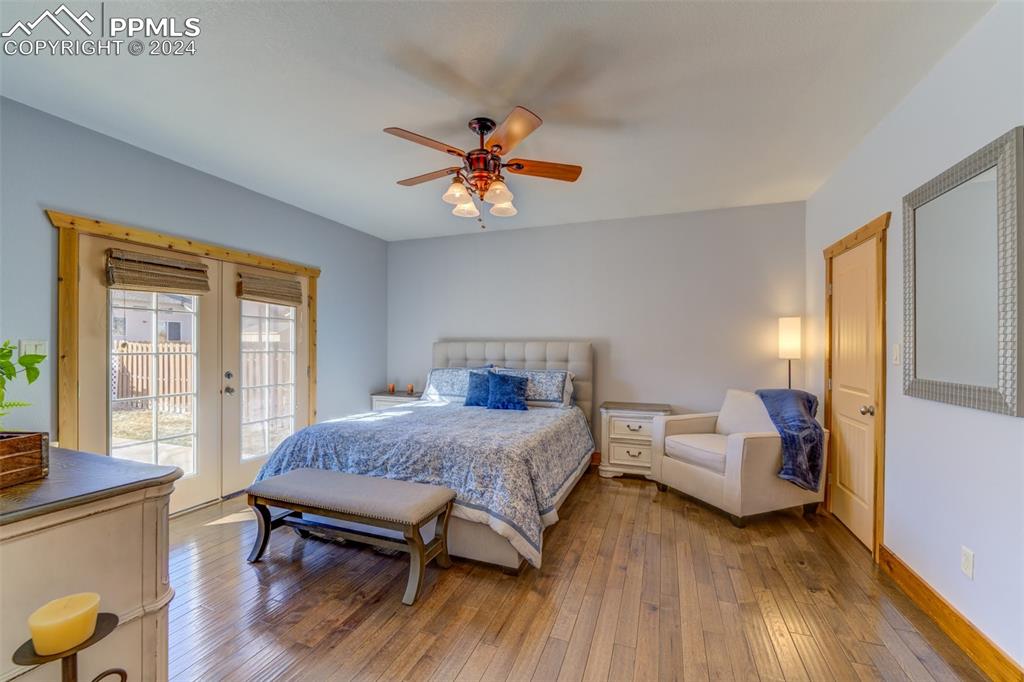 111 Rocchio Drive Florence, CO 81226 - Photo 41 of 50 a bedroom with a bed and wooden floor