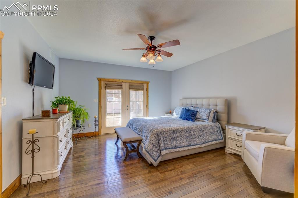 111 Rocchio Drive Florence, CO 81226 - Photo 42 of 50 a bedroom with a bed and a flat screen tv