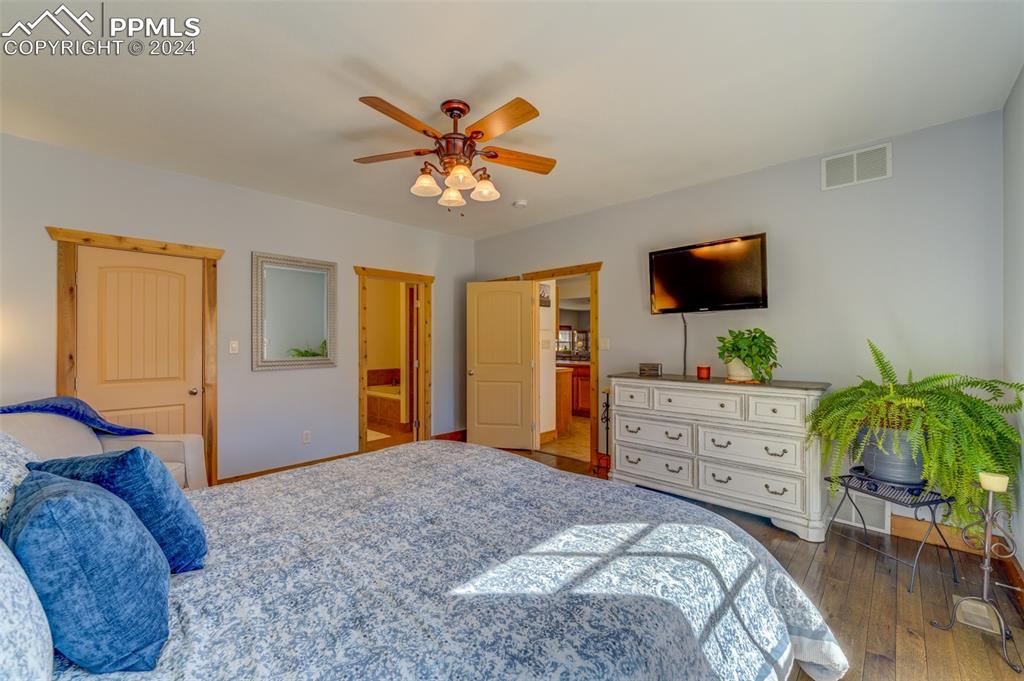111 Rocchio Drive Florence, CO 81226 - Photo 44 of 50 a bedroom with a bed and a flat screen tv