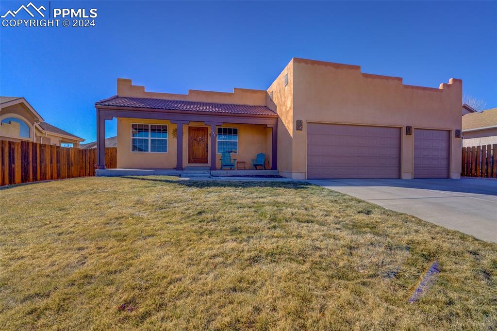 111 Rocchio Drive Florence, CO 81226 - Photo 8 of 50 a front view of a house with a yard