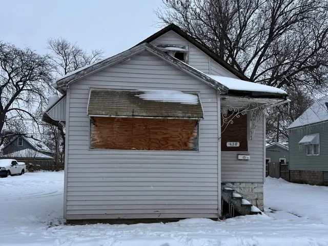 a front view of a house with garage