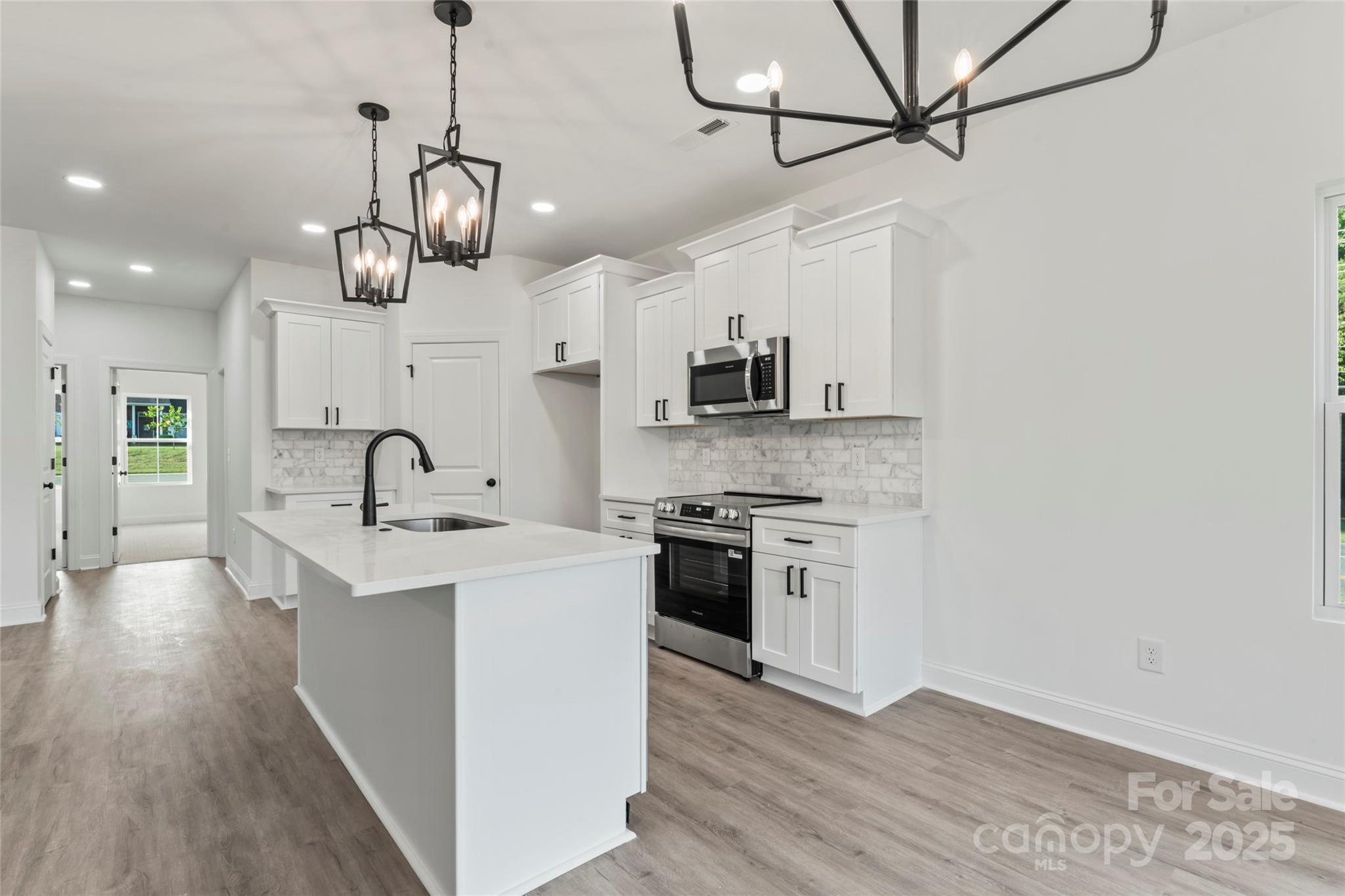 1 Morehead Road Harrisburg, NC 28075 - Photo 12 of 32 a view of a kitchen counter space a sink and appliances