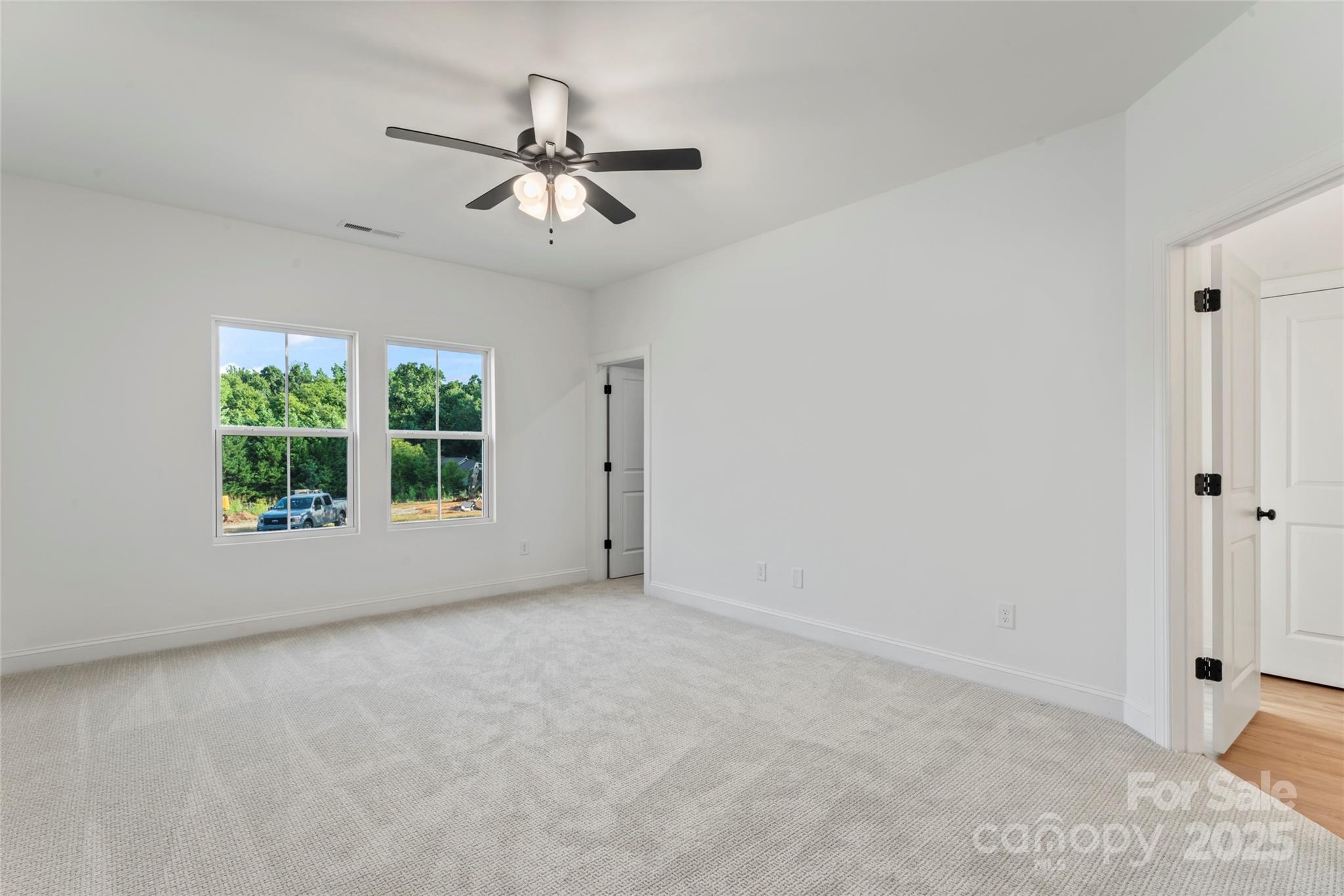 1 Morehead Road Harrisburg, NC 28075 - Photo 15 of 32 a view of a livingroom with a ceiling fan and window