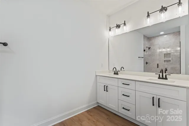 a bathroom with a glass shower door